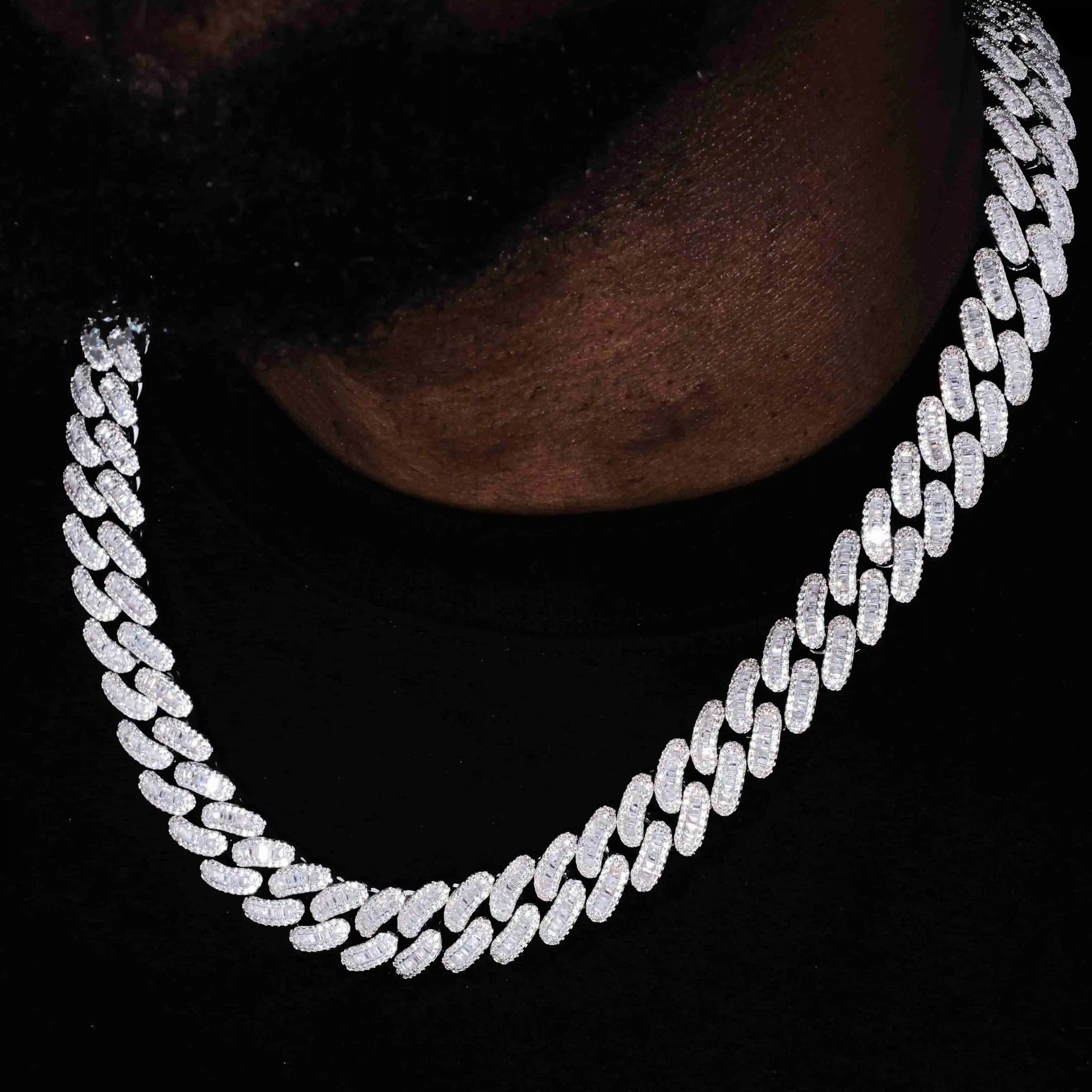 The 16MM Baguette Cuban Link Chain is custom-designed, molded and features hand-set stones that will upgrade any outfit. Made of Copper and plated in white gold, this exclusive piece boasts Flawless VVS Simulated Diamonds. Available in various lengths and weighing 18-150g, it comes with a dust bag, gift box, jewelry cloth, and warranty. Boss up and flex with the tongshop!