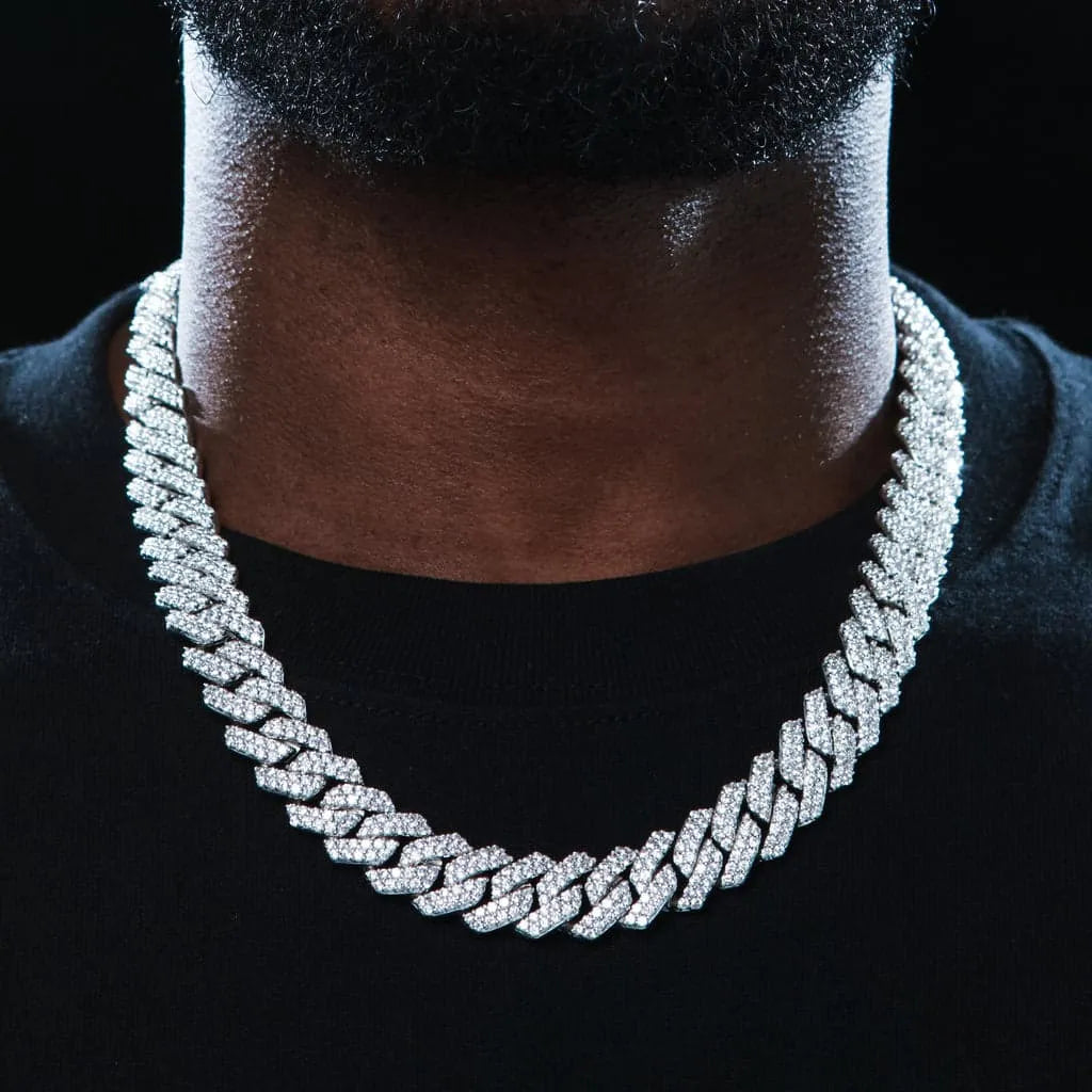 Upgrade your style with our new 14mm Iced Prong Cuban Chain! Featuring flawless VVS simulated diamonds and 18K gold or white gold finish, this handcrafted chain will set you apart! Available in 18", 20", and 24" lengths, choose your perfect fit. Each purchase comes with a chain, dust bag, gift box, jewelry cloth, and lifetime warranty. Shop now at TONGSHOP for the best quality and a 100% money back guarantee.